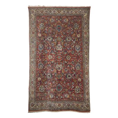Tappeto persiano, metà XX secolo, fondo rosso con decoro floreale