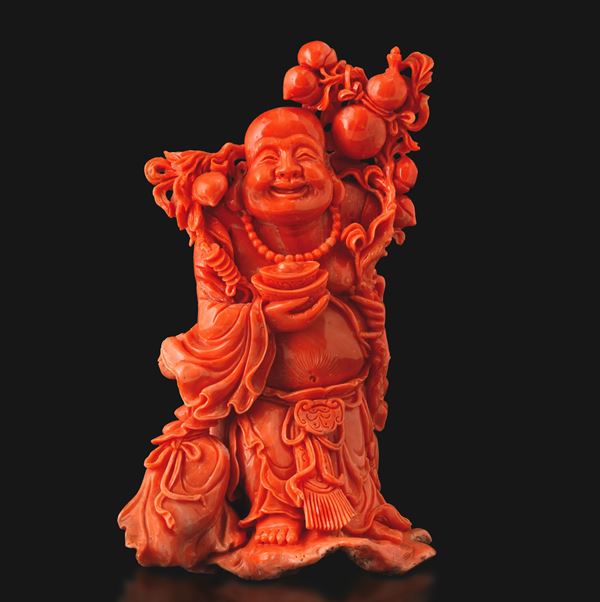 Carved coral figure of Budai, China, Qing Dynasty, 19th century.