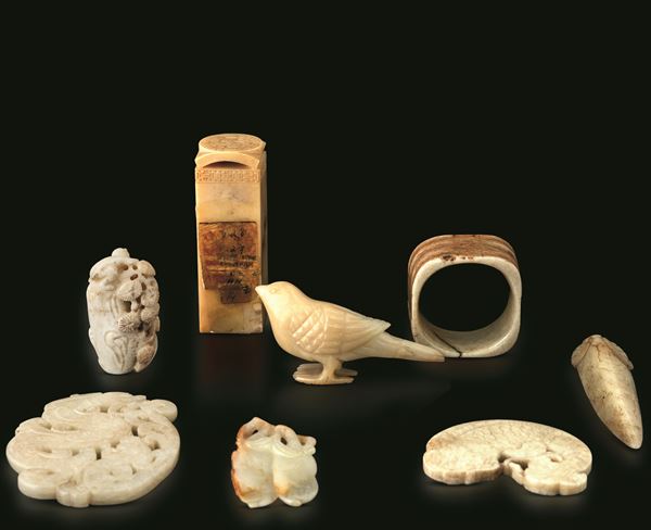 Lot comprising seven white jade elements, China, Qing Dynasty, 19th century.