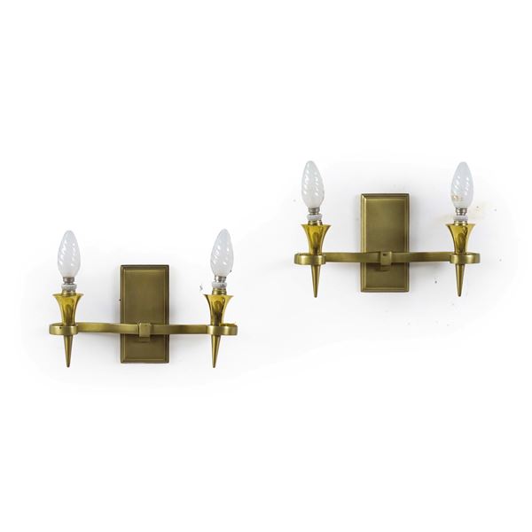 Coppia di appliques in metallo dorato. XX secolo