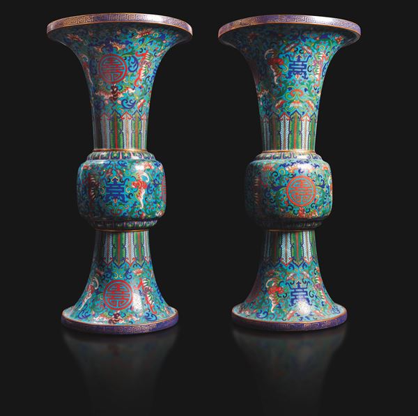 A pair of cloisonné enamel Huagu vases decorated with lotus flowers, bats and the Shou symbol, China, Qing Dynasty, Qianlong period (1736–1796).