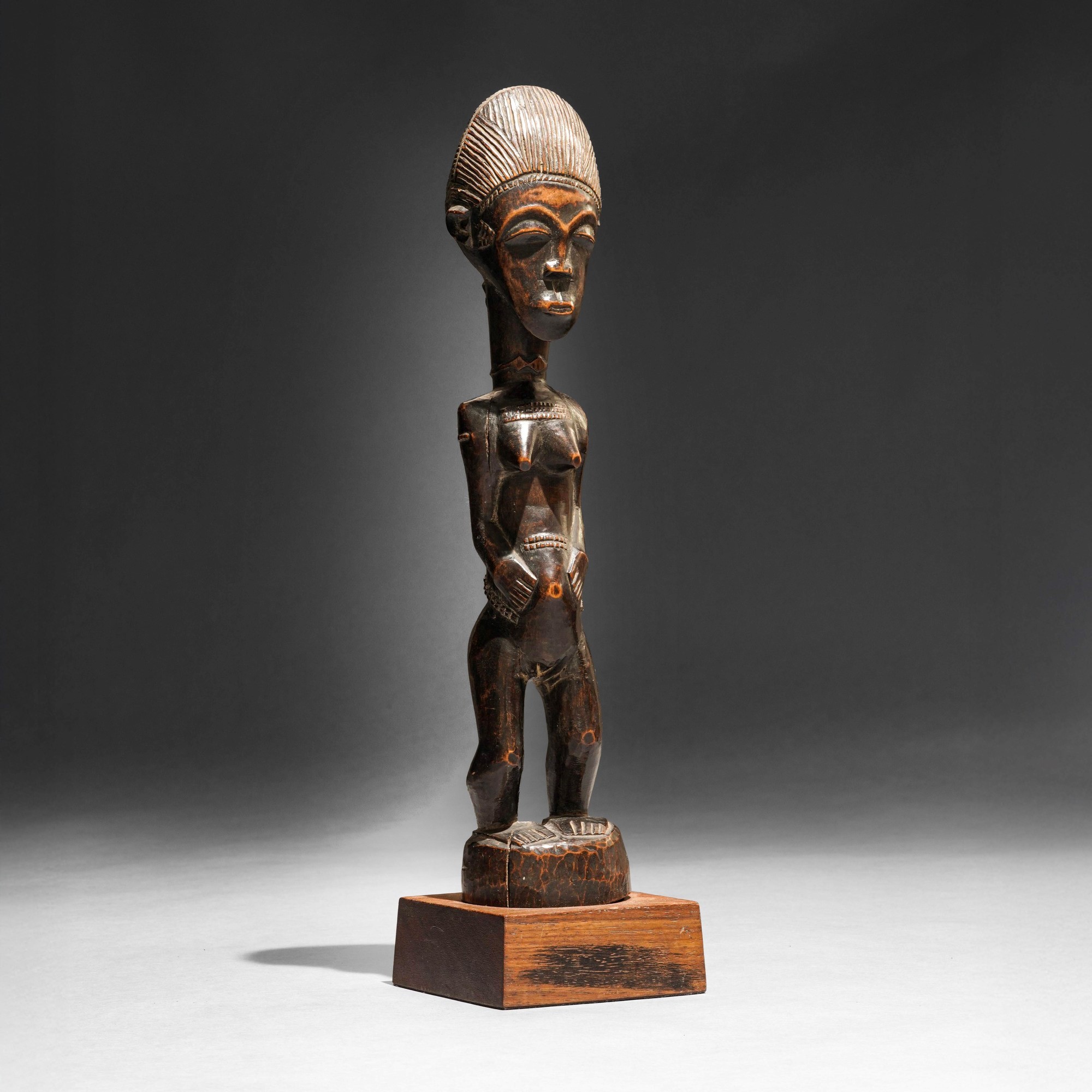 Baoulé, Statua in legno a patina scura (Costa d’Avorio), inizio XX secolo