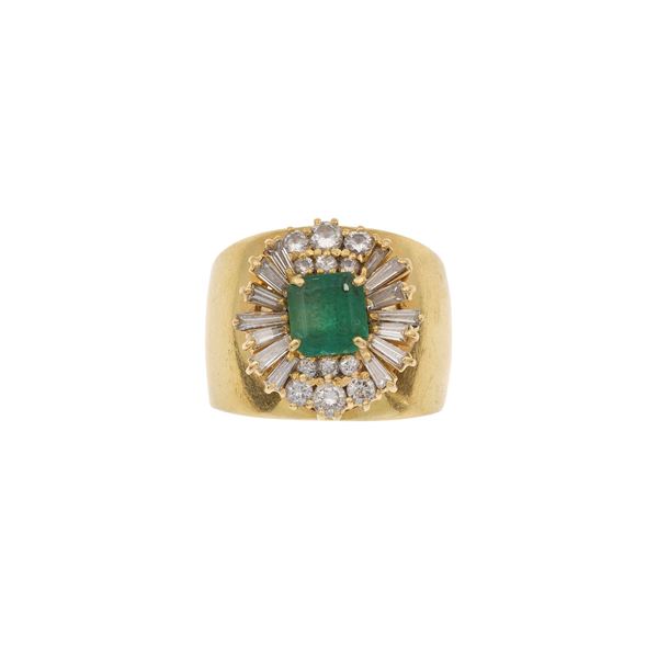 Anello a fascia con smeraldo centrale di ct 1.30 circa e diamanti a contorno