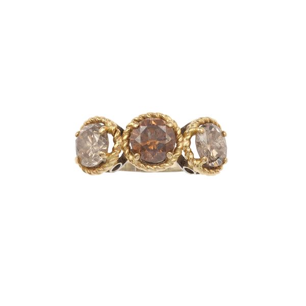 Three fancy brown diamonds and gold ring