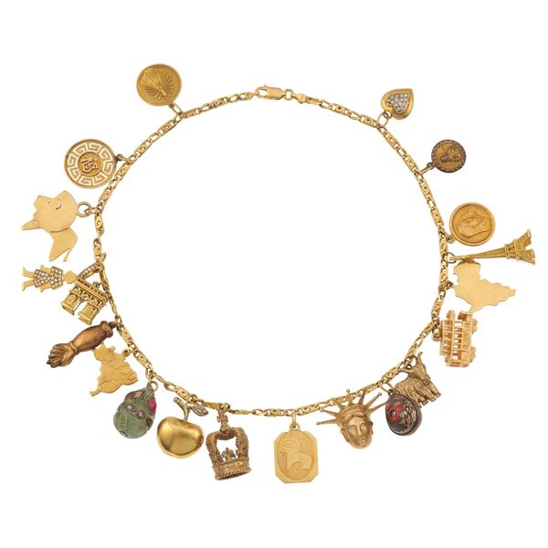 Gold, low-karat gold and metal necklace with charms