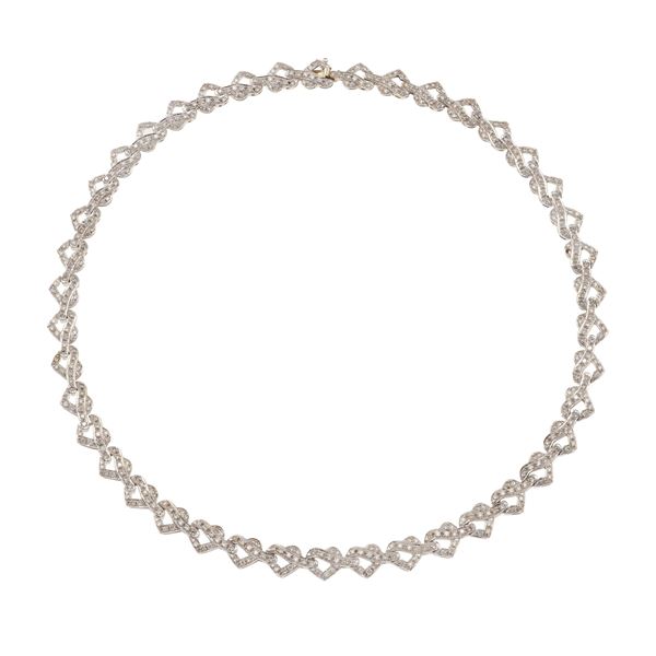Diamond and gold "heart" necklace. One missing diamond