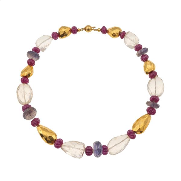 Rock crystal, carved ruby, iolite and gold necklace
