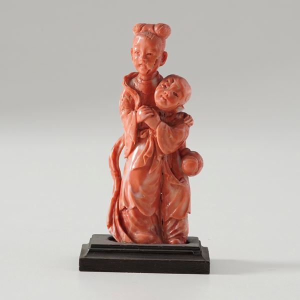 Small coral figure of a woman with a child