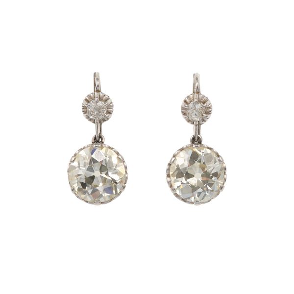 Pair of two old-cut diamond weighings 4.72 and 4.79 carats approximately, and gold earrings