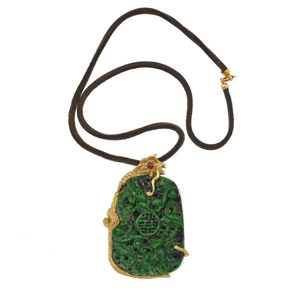 Carved jadeite and gold pendant
