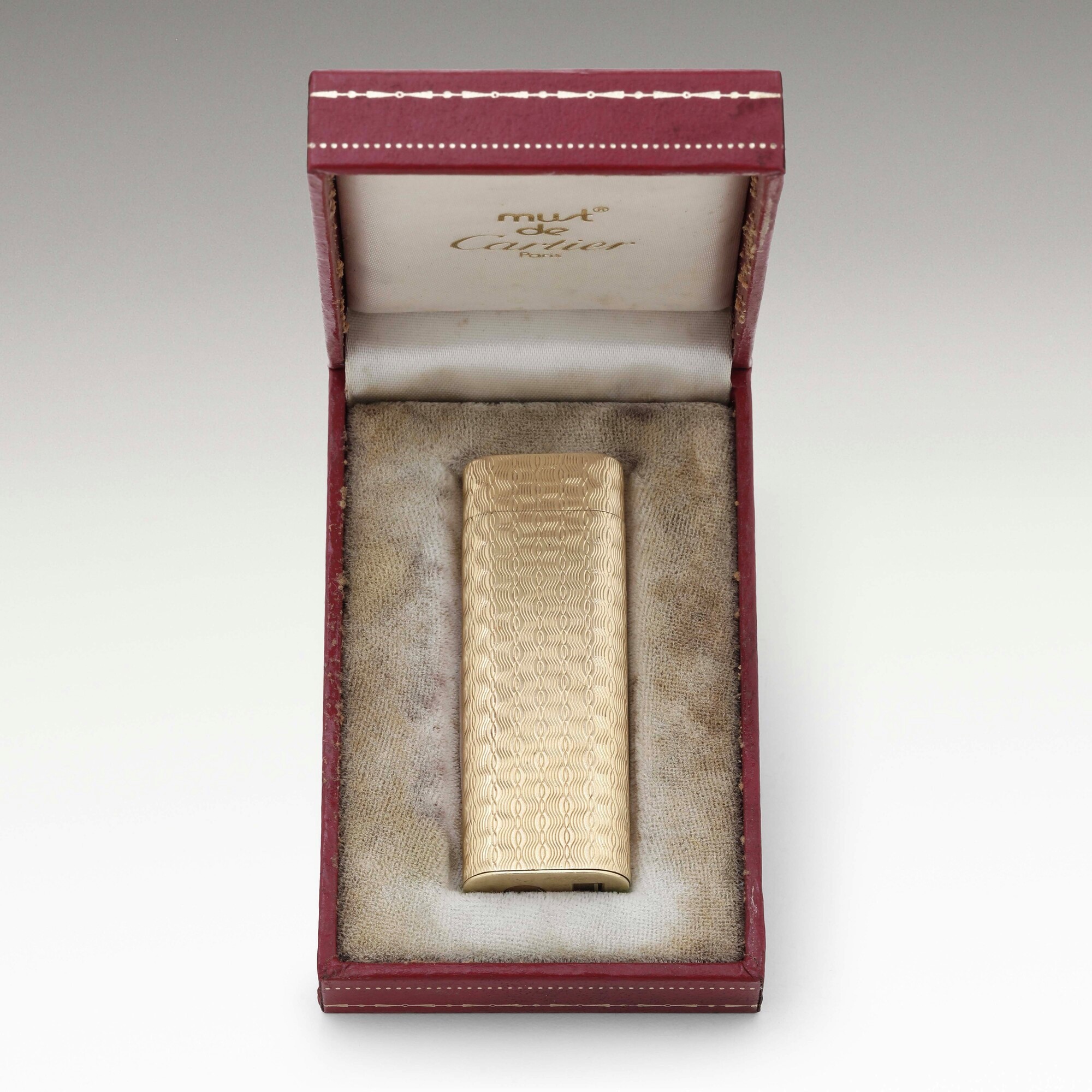 Cartier, Accendino in metallo placcato in oro