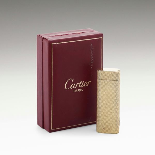 Cartier. Accendino in metallo placcato in oro 750
