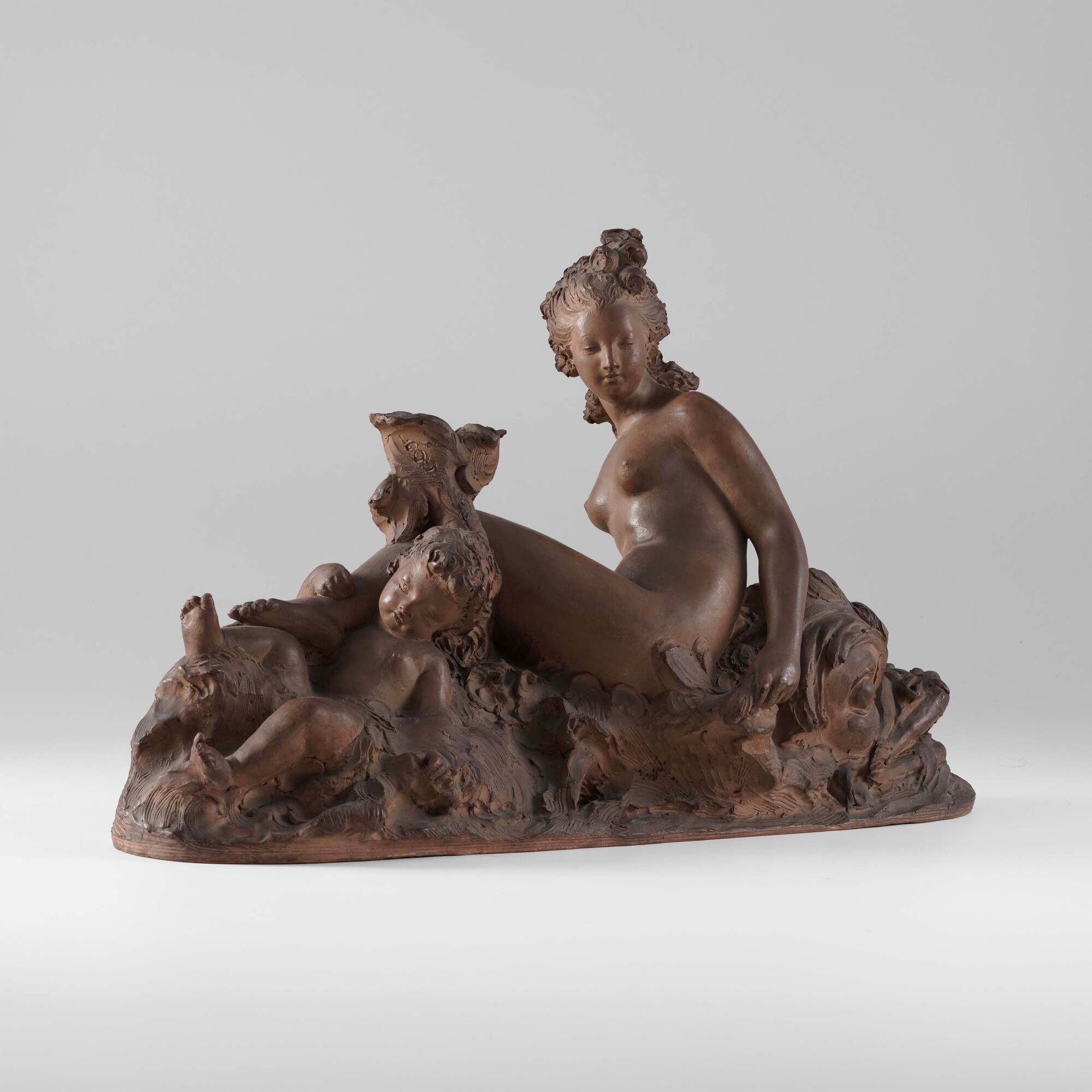 Fernand Lion, Plastificatore in terracotta con Venere e Amore a cavallo di un delfino
