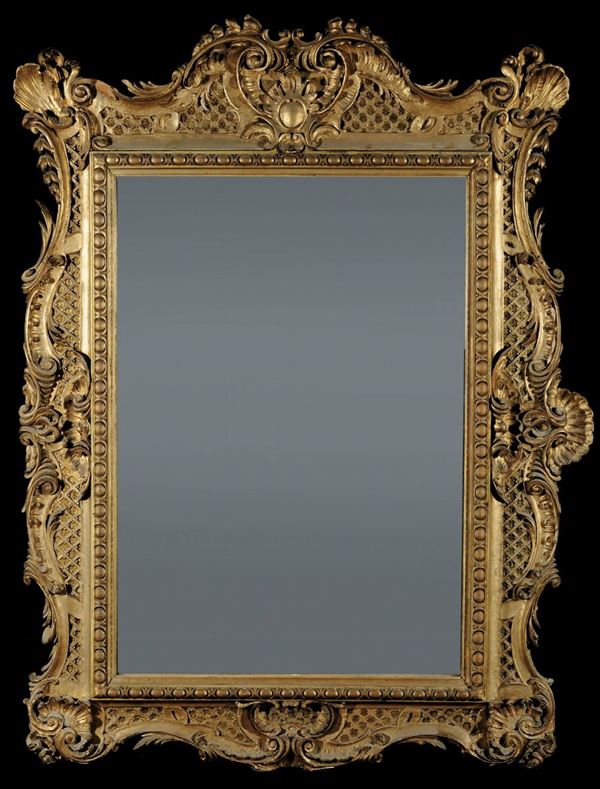 Specchiera in stile Luigi XIV in legno intagliato e dorato