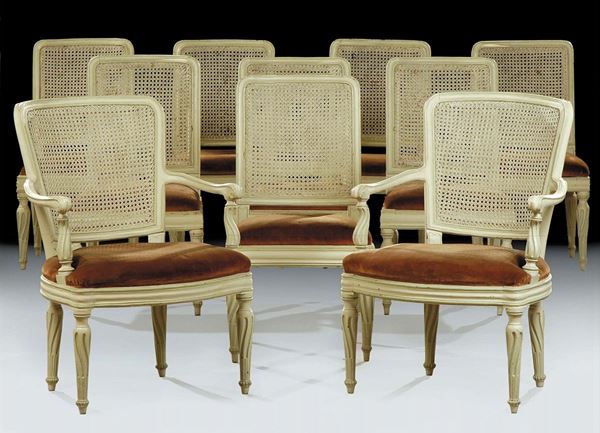 Otto sedie e due poltrone laccate in stile Luigi XVI