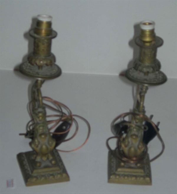Coppia di candelieri ad una luce in metallo dorato, XIX secolo