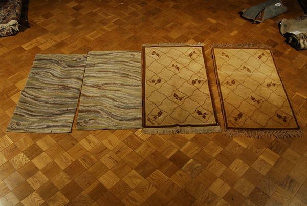 Lotto di quattro tappeti meccanici, XX secolo