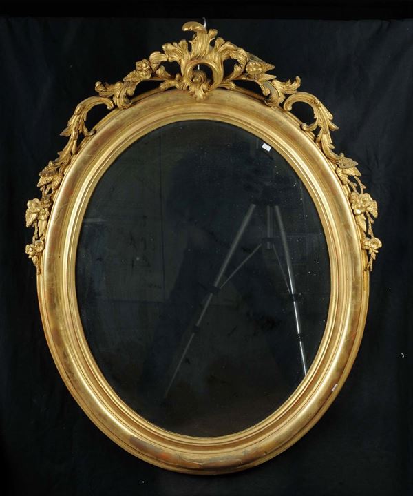 Specchiera ovale in legno dotato