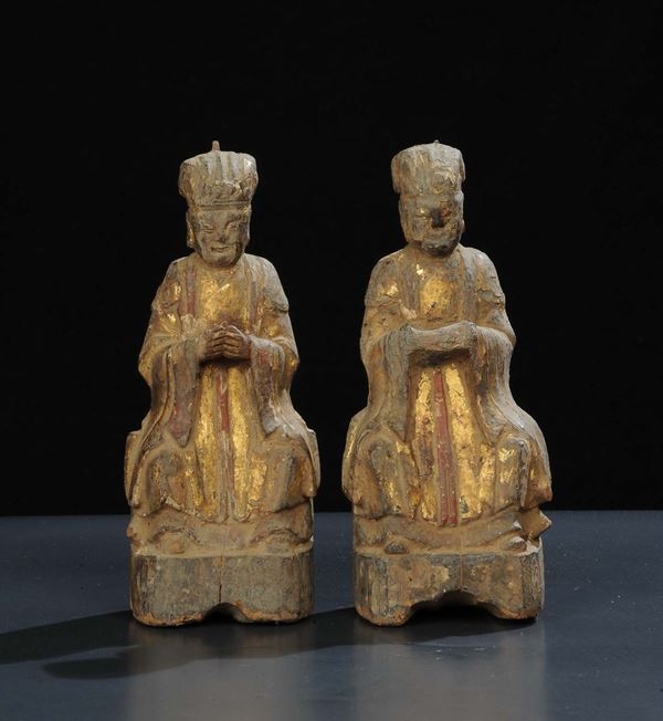 Coppia di statuette Ming in legno dorato, 1660-80