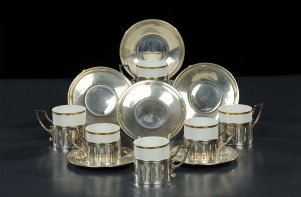 Sei tazzine in argento e porcellana con bordino dorato, XX secolo