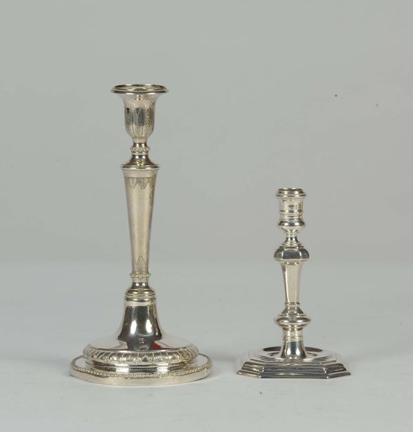 Due candelieri antichi diversi in argento