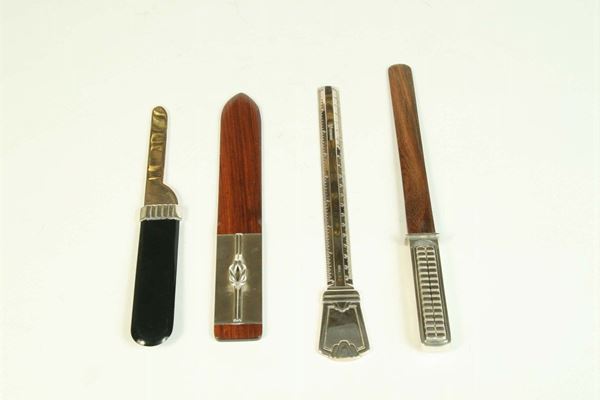 Quattro tagliacarte diversi in legno e argento