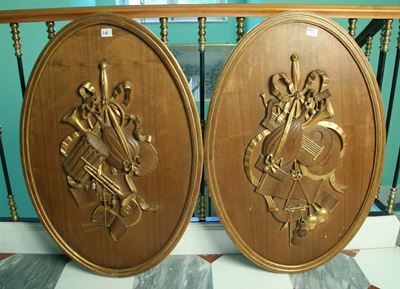 Due Pannelli Ovali in Legno Intagliato e Parzialmente Dorato, XX Secolo