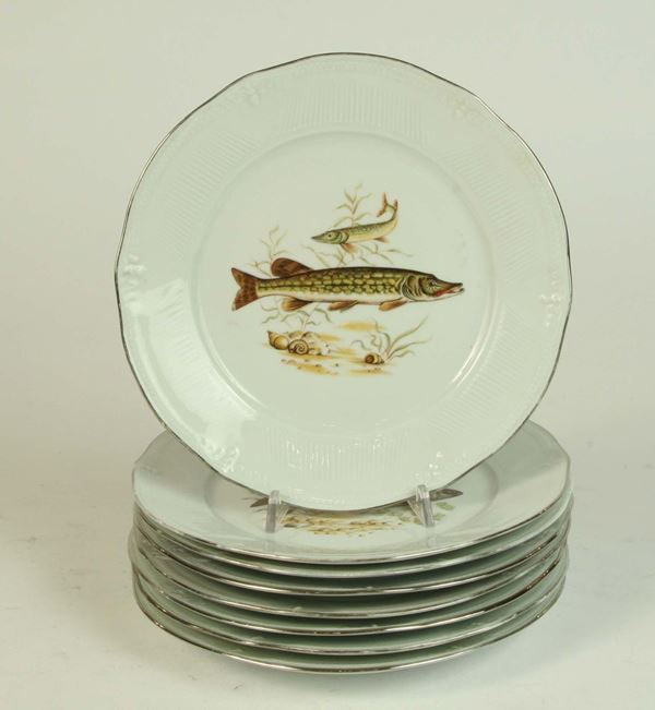 Otto piatti in porcellana di Limoges con pesci