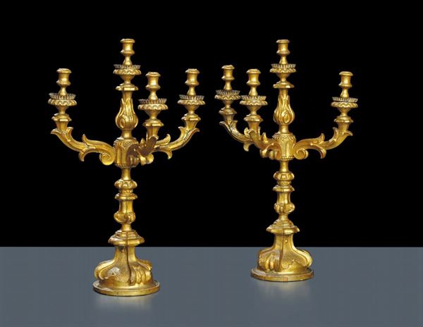 Coppia di candelieri a quattro luci in legno intagliato e dorato, Toscana XIX secolo