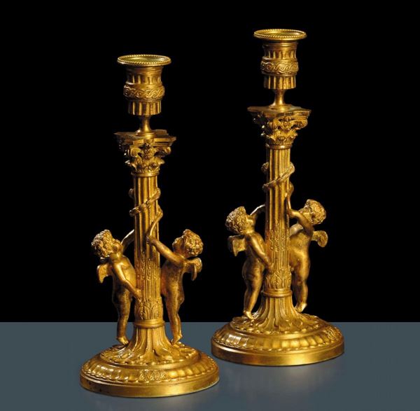 Coppia di candelieri Luigi XVI in bronzo dorato, XIX secolo