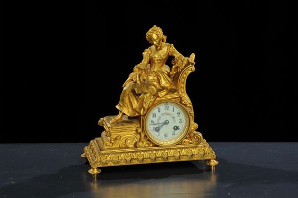 Orologio in antimonio dorato con damina a tuttotondo, XIX secolo