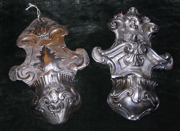 Due acquasantiere in argento sbalzato e cesellato, XIX secolo