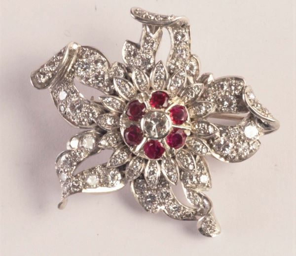 A diamond, ruby and platinum brooch